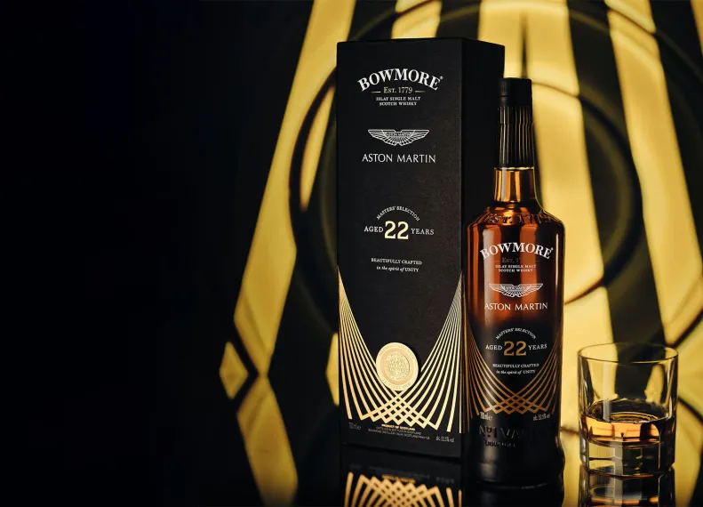 bowmore and aston martin masters reunite for the introduction of masters selection 22 year old single malt scotch whisky