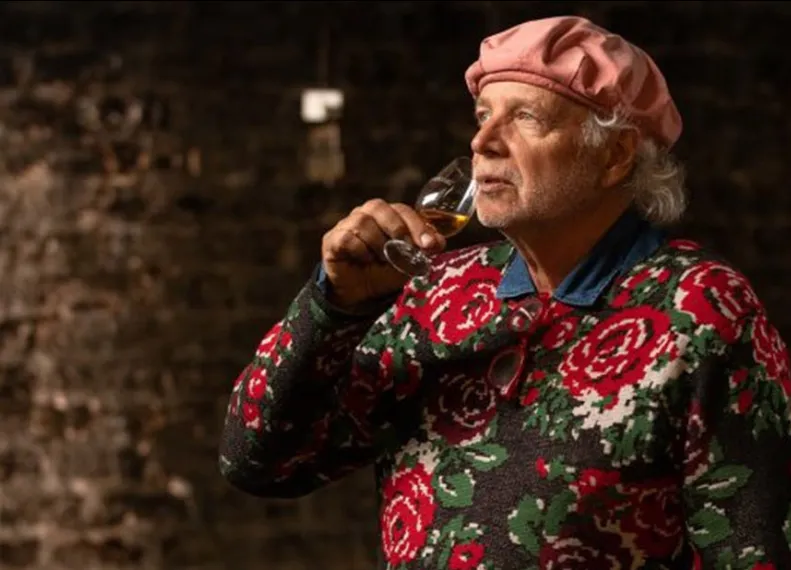 taste trailblazer sipping a glass of laphroaig