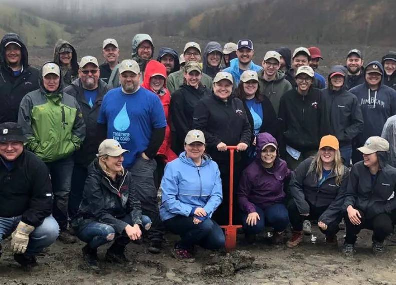 beam Suntory employees gathered together for a photo on site of a community service event