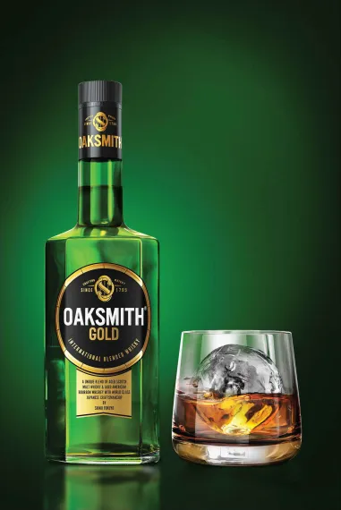 Oaksmith Gold bottle and glass image
