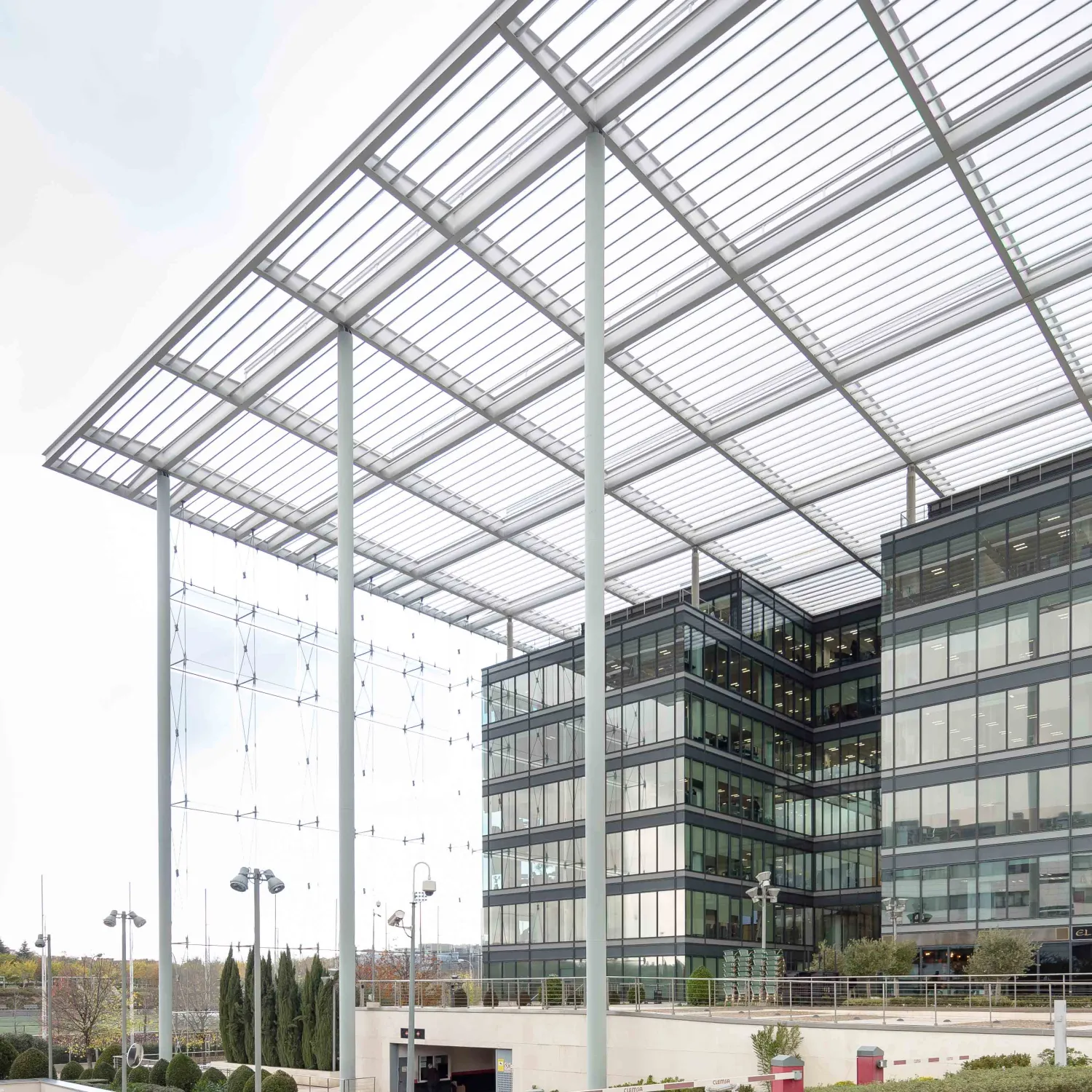 Modern, glass facade of an office building.