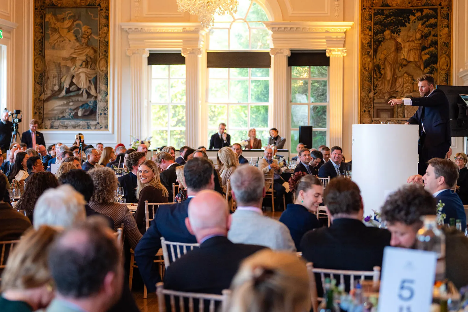 Jonny Fowle, Sotheby's Global Head of Spirits fielding bids at The Distillers One of One Auction